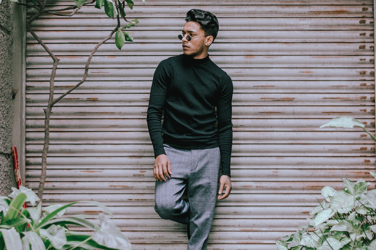 man wearing pleated pants