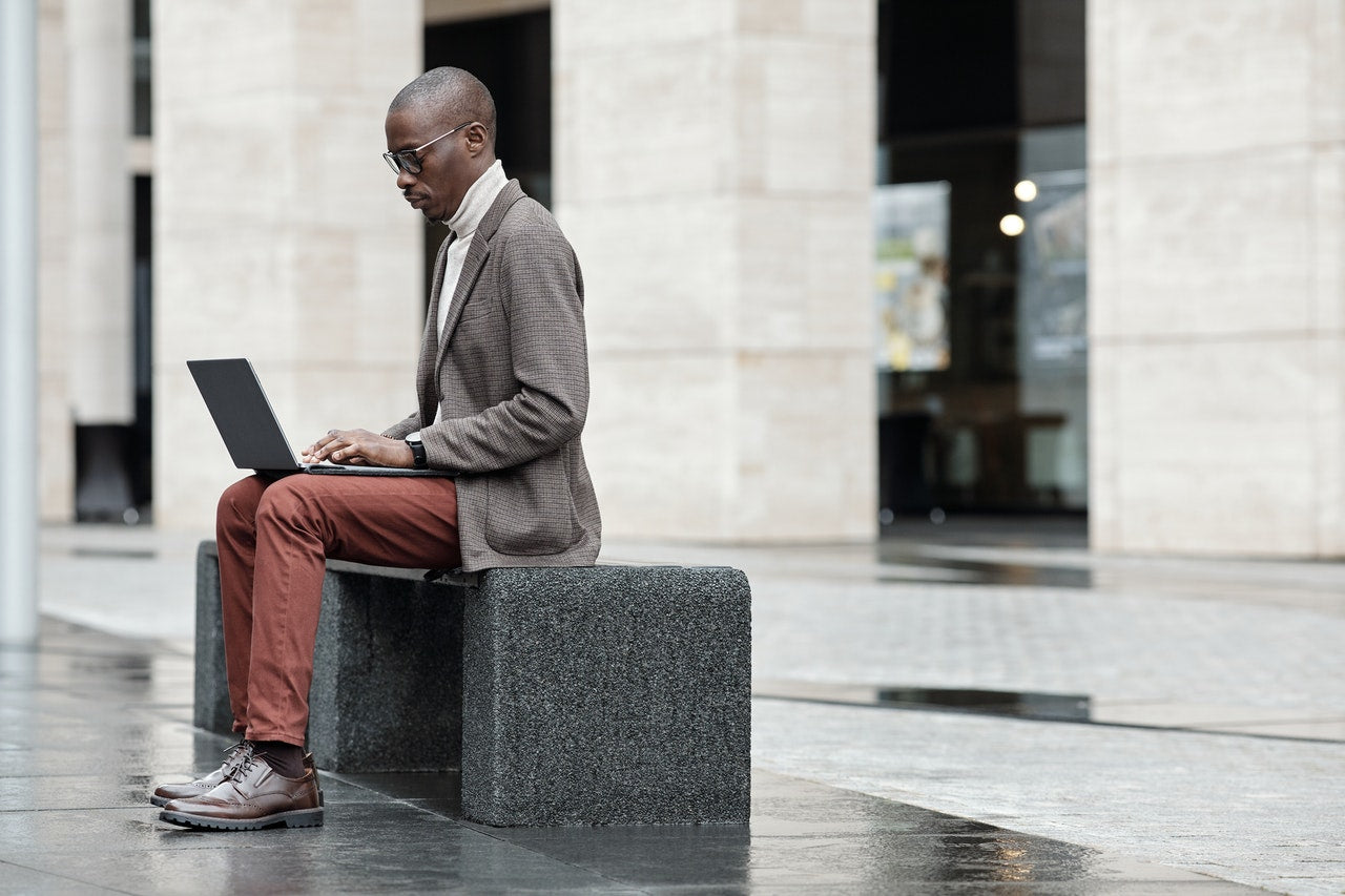 stylish man using his laptop